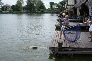 Family fishing Bangkok at Bungsamran Lake Thailand
